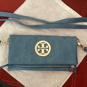 Blue crossbody, probably a knockoff? No idea